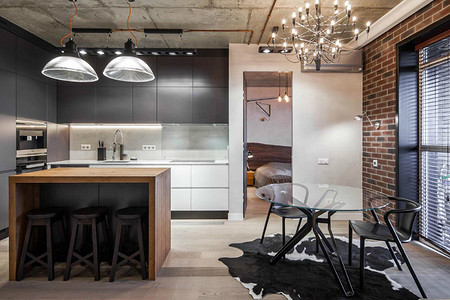 Интерьер в стиле лофт: кирпичные стены и деревянная мебель