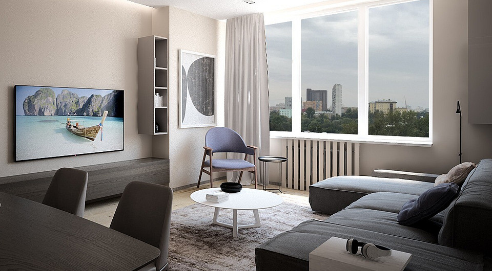 Обстановку зоны отдыха составляет просторный угловой диван неброского серого оттенка, сидя на котором можно смотреть телевизор. 